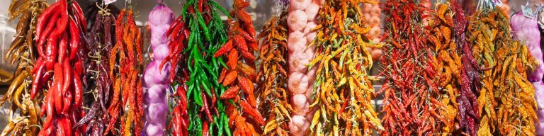 Several types of hanging red peppers